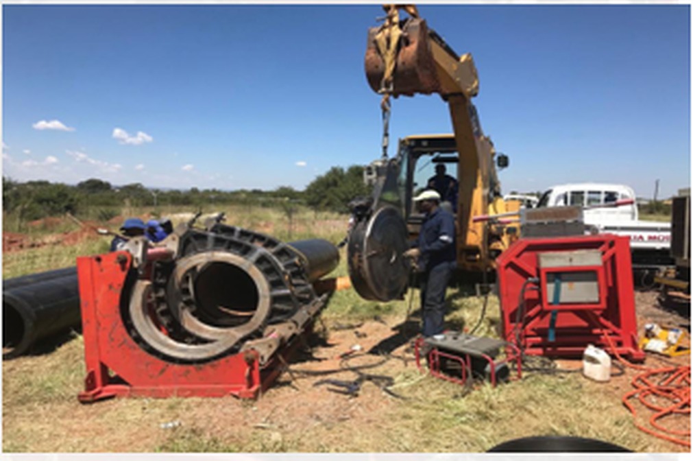 HDPE butt welding machine joining pipe sections on site
